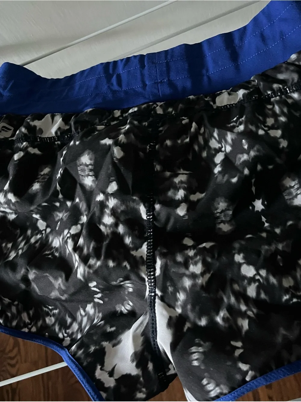 Fabletics - Black & White Marble Print Athletic Shorts with Royal Blue Trim - Picture 2 of 5